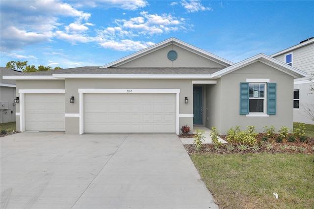 single story home featuring a garage