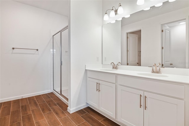 bathroom featuring walk in shower and vanity