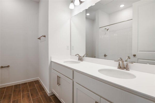 bathroom with vanity and a shower