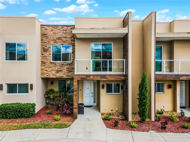 view of front of home with a balcony