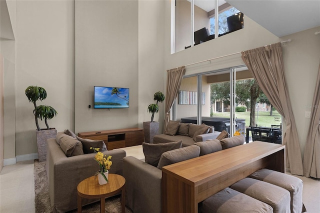 living room featuring a towering ceiling