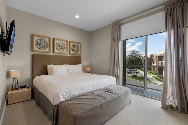 carpeted bedroom featuring access to outside