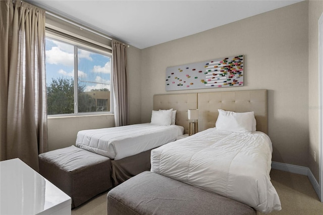 bedroom featuring light colored carpet