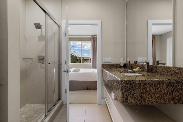 bathroom featuring tile patterned floors, sink, and an enclosed shower