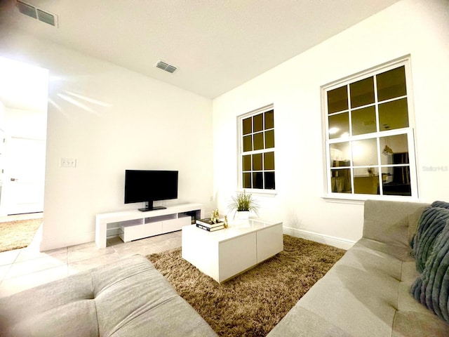 living room with tile patterned flooring