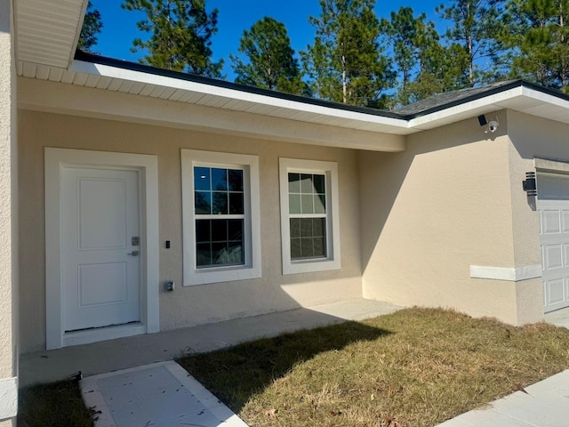 property entrance featuring a garage