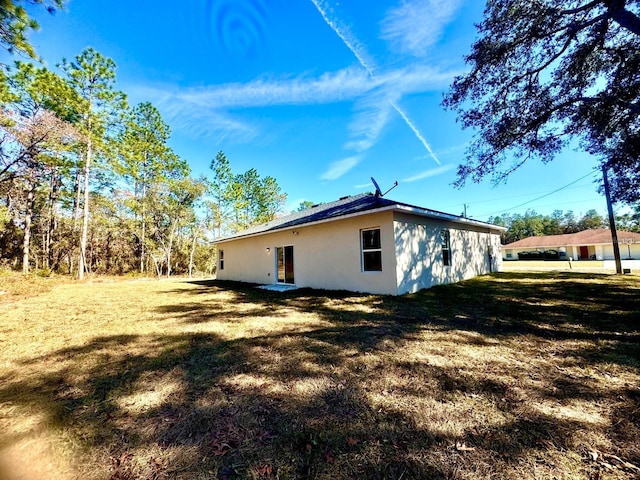 view of home's exterior featuring a lawn