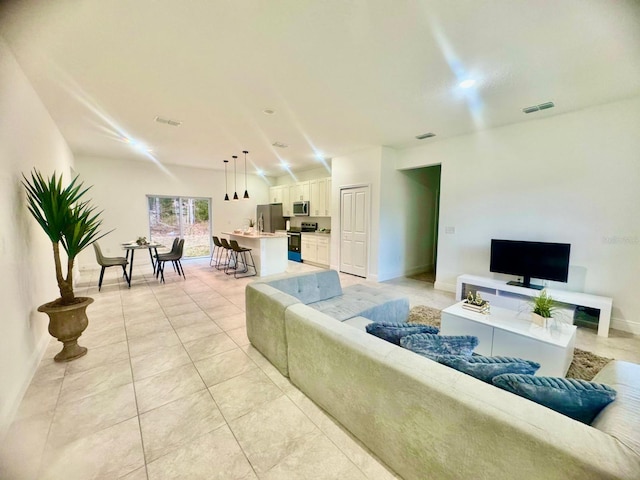 living room featuring light tile patterned flooring