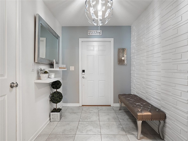 entryway featuring baseboards and light tile patterned floors