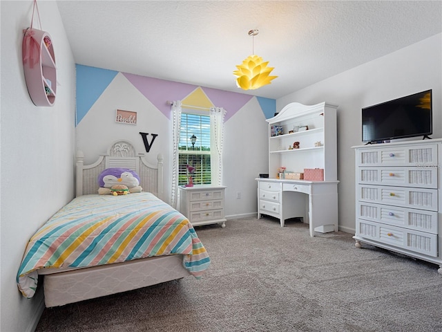 carpeted bedroom with a textured ceiling