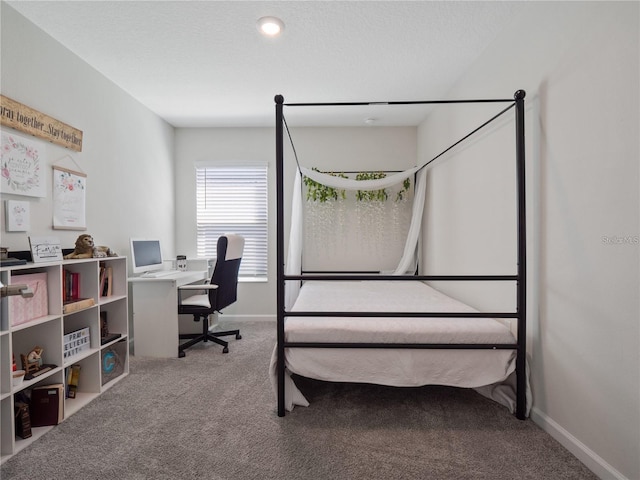 bedroom featuring carpet floors and baseboards