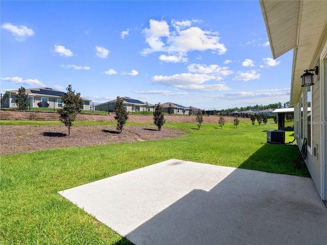 view of yard featuring a patio area and central AC unit