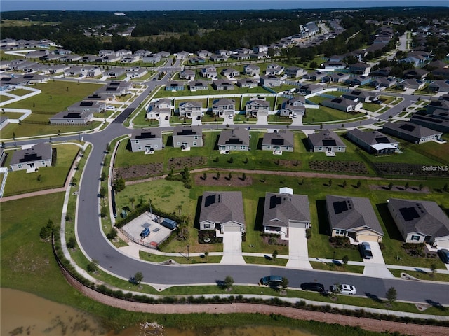 aerial view of property and surrounding area with nearby suburban area
