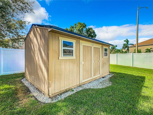 view of outdoor structure featuring a yard