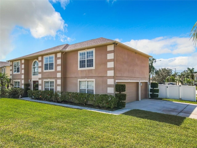 view of side of property with a garage and a lawn