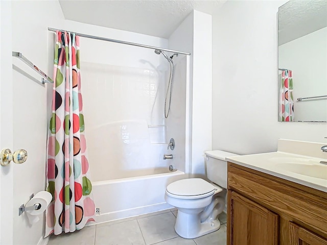 full bathroom featuring shower / tub combo with curtain, vanity, toilet, tile patterned floors, and a textured ceiling