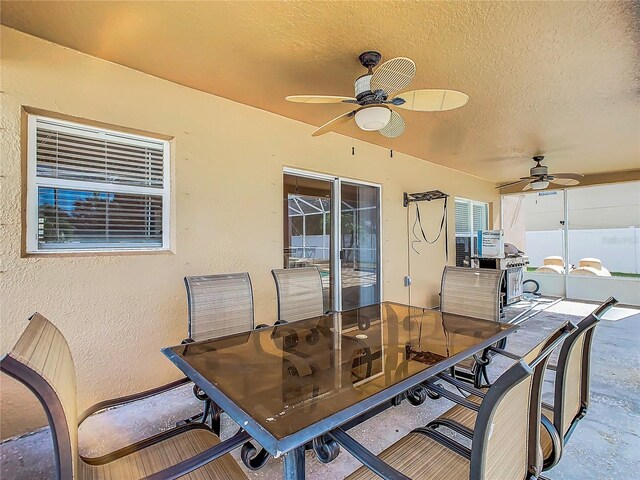 view of patio / terrace featuring ceiling fan