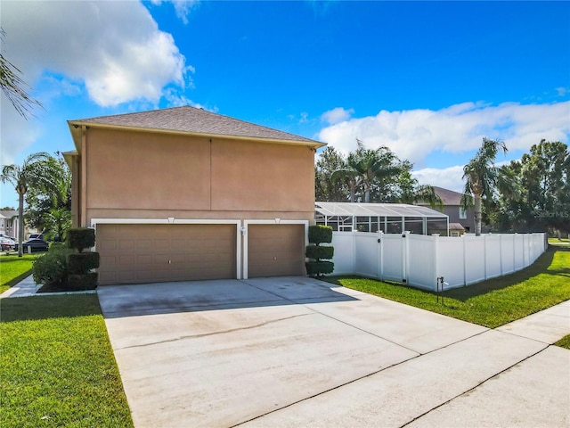 view of side of property featuring a lawn