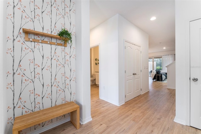 hall with light hardwood / wood-style floors