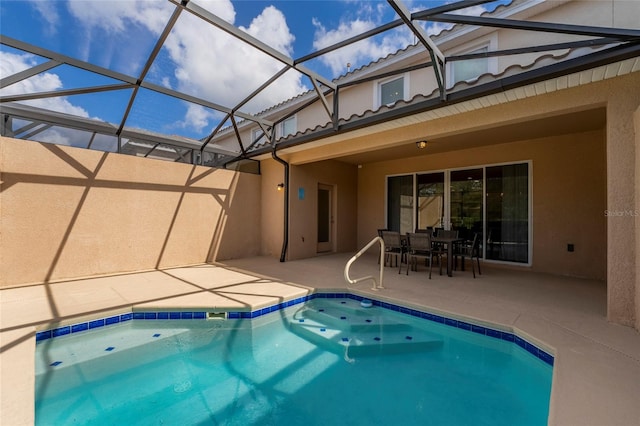 view of swimming pool with a patio and a lanai