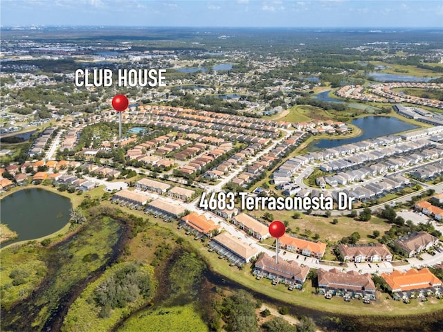 birds eye view of property featuring a water view