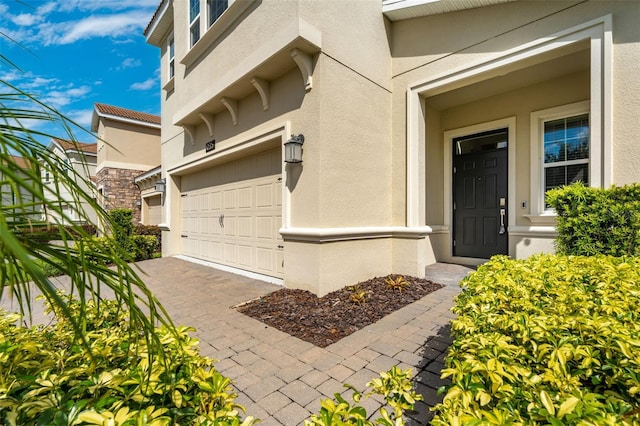 doorway to property featuring a garage