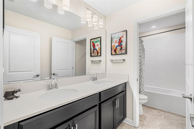 full bathroom with toilet, vanity, tile patterned floors, and shower / tub combo