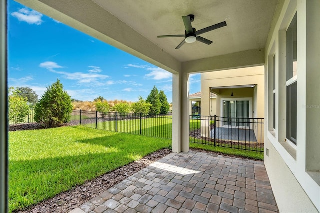 view of patio featuring ceiling fan