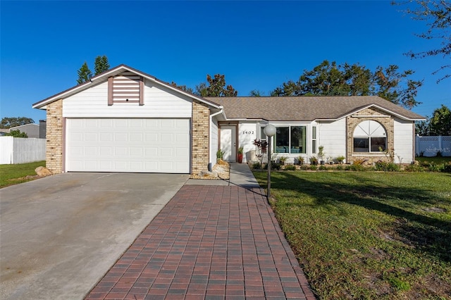 ranch-style home with a front yard and a garage