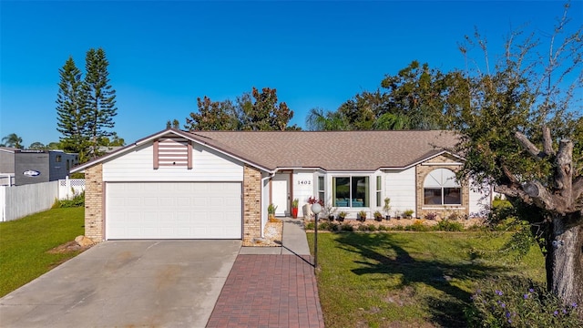 ranch-style house featuring a front yard and a garage