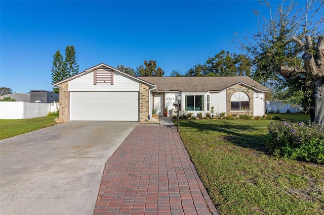 ranch-style house featuring a front lawn and a garage