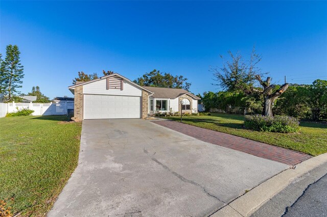 1402 Westminster Way, Kissimmee, FL 34744 - ranch-style home with concrete driveway and an attached garage