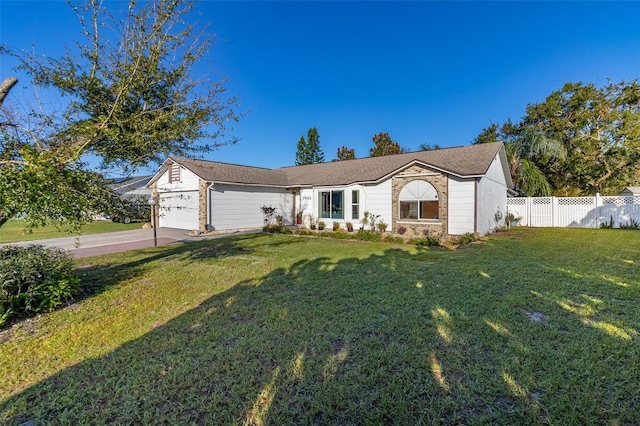 single story home featuring a front yard and a garage