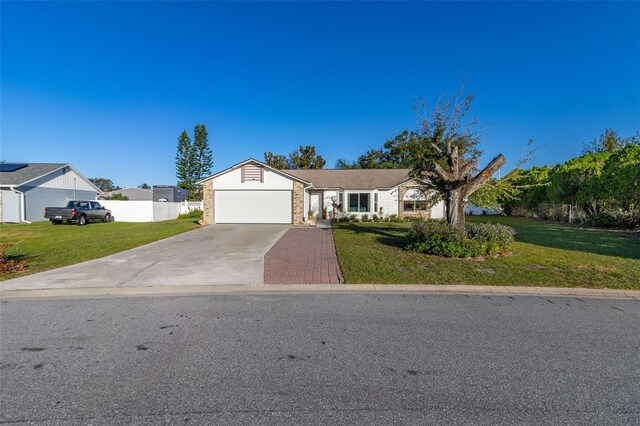 1402 Westminster Way, Kissimmee, FL 34744 - ranch-style house with concrete driveway and an attached garage