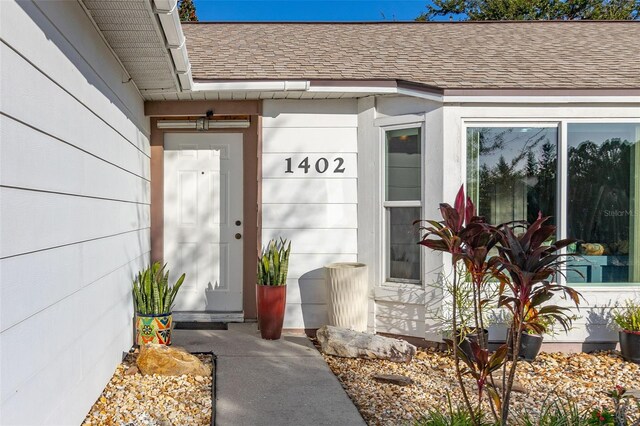 1402 Westminster Way, Kissimmee, FL 34744 - view of exterior entry with a shingled roof