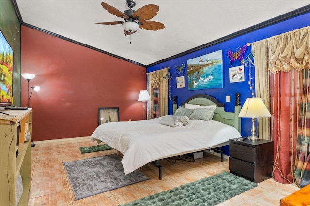 bedroom with crown molding, hardwood / wood-style flooring, lofted ceiling, and ceiling fan