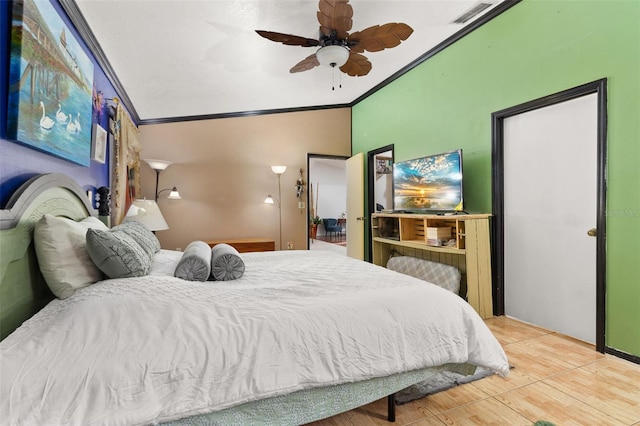 bedroom with ceiling fan, hardwood / wood-style flooring, and ornamental molding