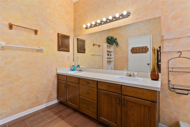 1402 Westminster Way, Kissimmee, FL 34744 - bathroom with double vanity, wood tiled floors, and baseboards