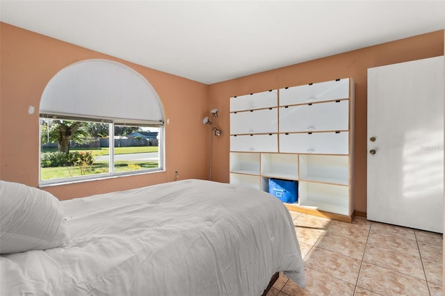 bedroom featuring light tile patterned flooring