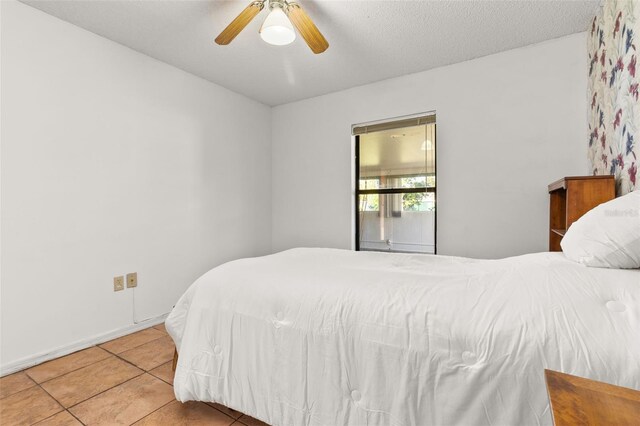 1402 Westminster Way, Kissimmee, FL 34744 - tiled bedroom featuring a ceiling fan