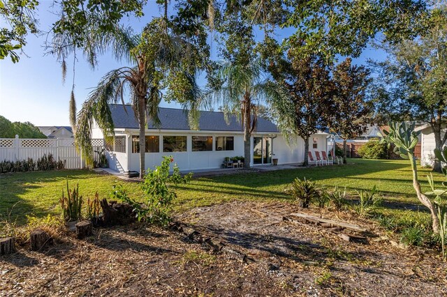 1402 Westminster Way, Kissimmee, FL 34744 - back of house with a sunroom