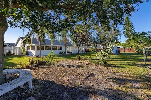 view of yard with a sunroom