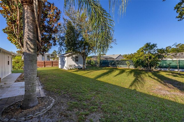 1402 Westminster Way, Kissimmee, FL 34744 - view of yard featuring an outbuilding