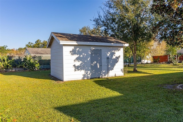 view of outdoor structure featuring a yard