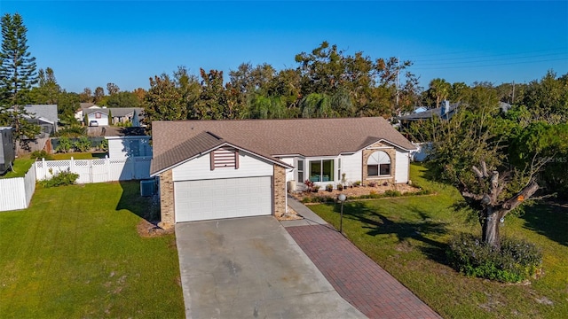 view of front facade featuring a front yard and a garage