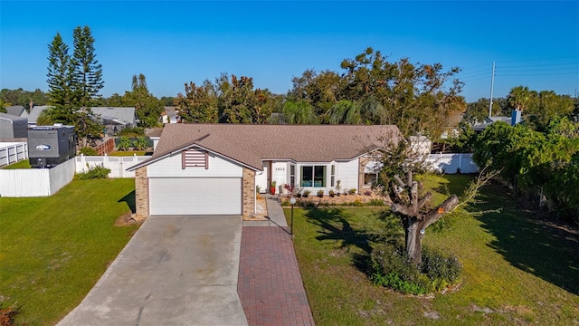 single story home with a front yard and a garage