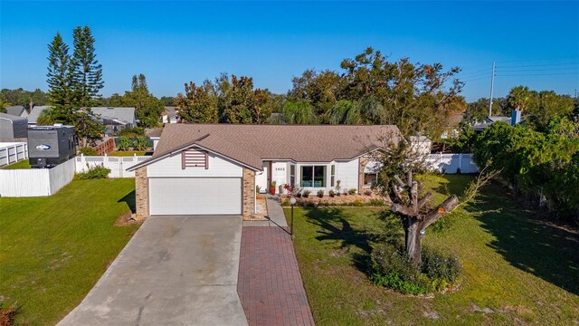 1402 Westminster Way, Kissimmee, FL 34744 - single story home with concrete driveway and an attached garage