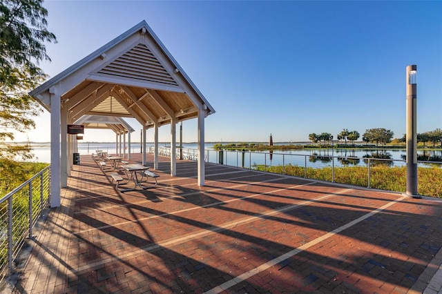 view of property's community with a gazebo and a water view