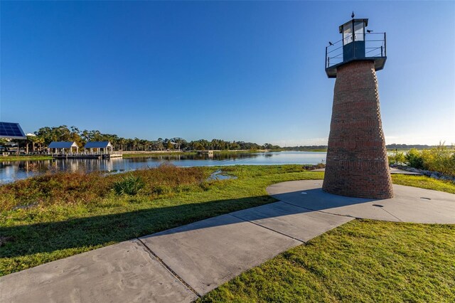 1402 Westminster Way, Kissimmee, FL 34744 - view of home's community with a water view and a lawn