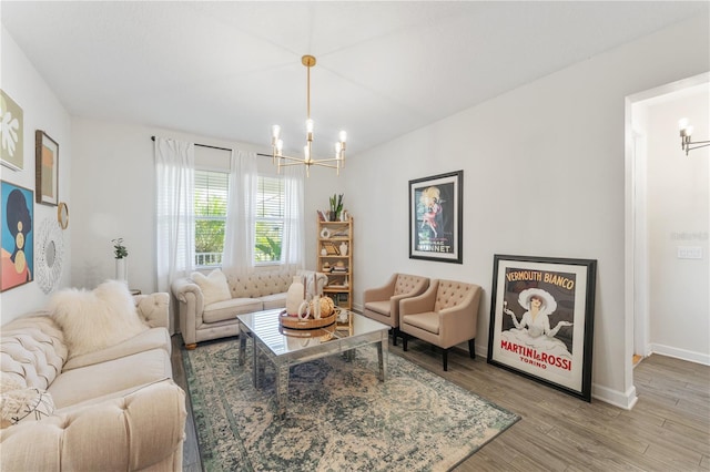 living room featuring a chandelier and wood-type flooring